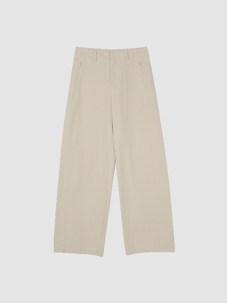 Shop the Arkin Studio trousers collection, featuring the hero image of a classic pair of khaki curved-leg pants