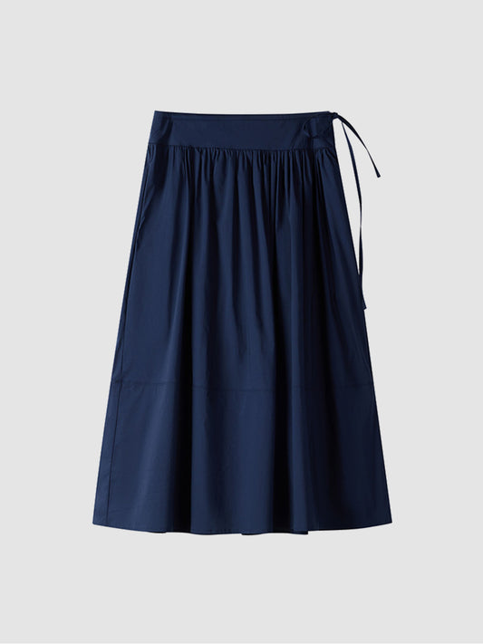 Arkin Studio lightweight pleated a-line drawstring skirt in dark navy, main view on white background