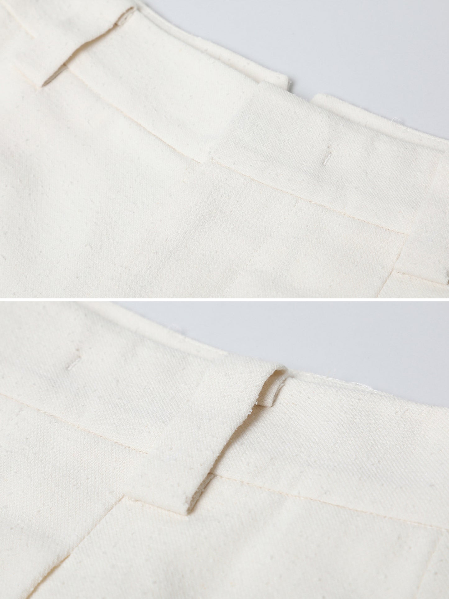 Close up of Arkin Studio minimalist cuffed a-line shorts in ivory, focusing the front and back of the waist