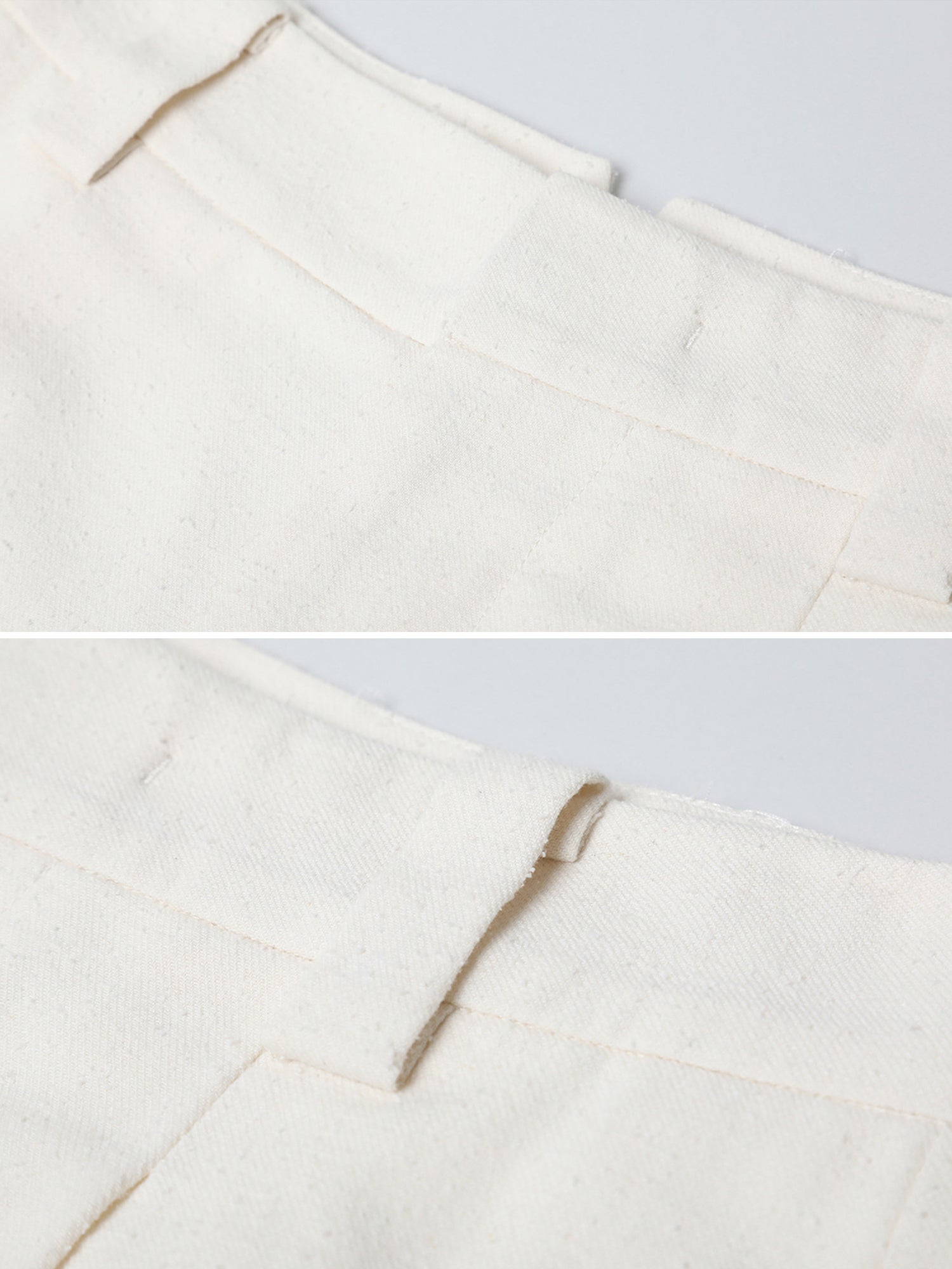 Close up of Arkin Studio minimalist cuffed a-line shorts in ivory, focusing the front and back of the waist